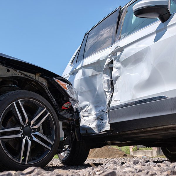 A black crashes into the side door of a silver car.